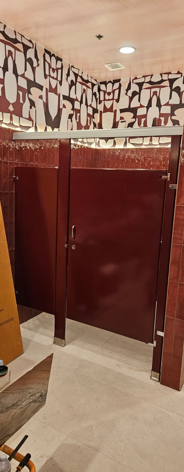 Burgundy powder-coated steel commercial restroom stalls at Casa Mezcal in Orlando, Florida