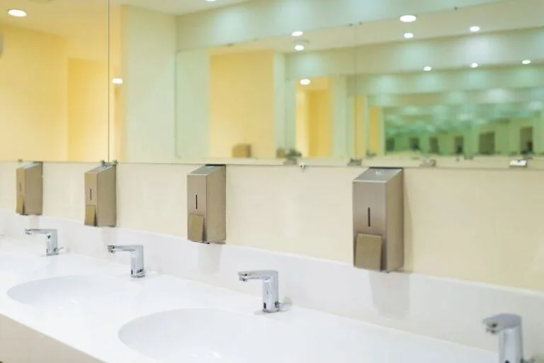 Toilet Compartment Accessories in a completed commercial restroom