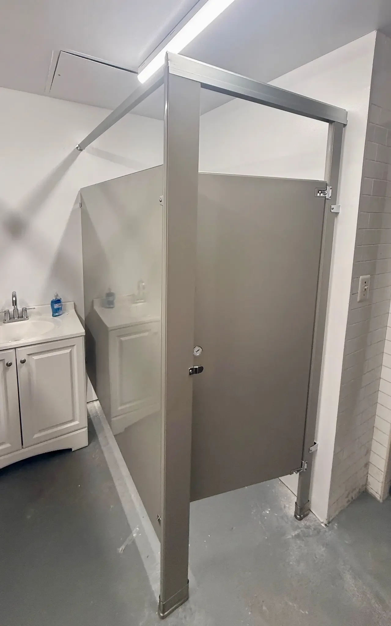 Additional view of a powder-coated-steel commercial restroom stall at Cine Magic LIC Studios in Long Island City, New York
