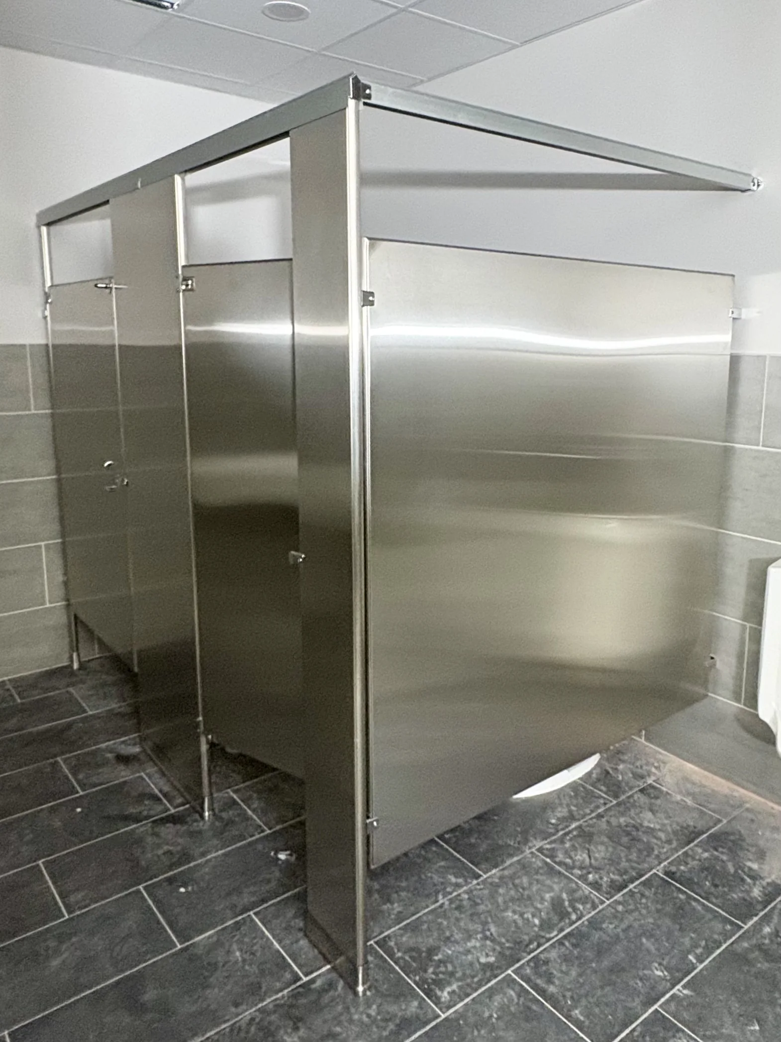 Stainless-steel restroom screen and compartments at Compal USA Technology in Georgetown, Texas