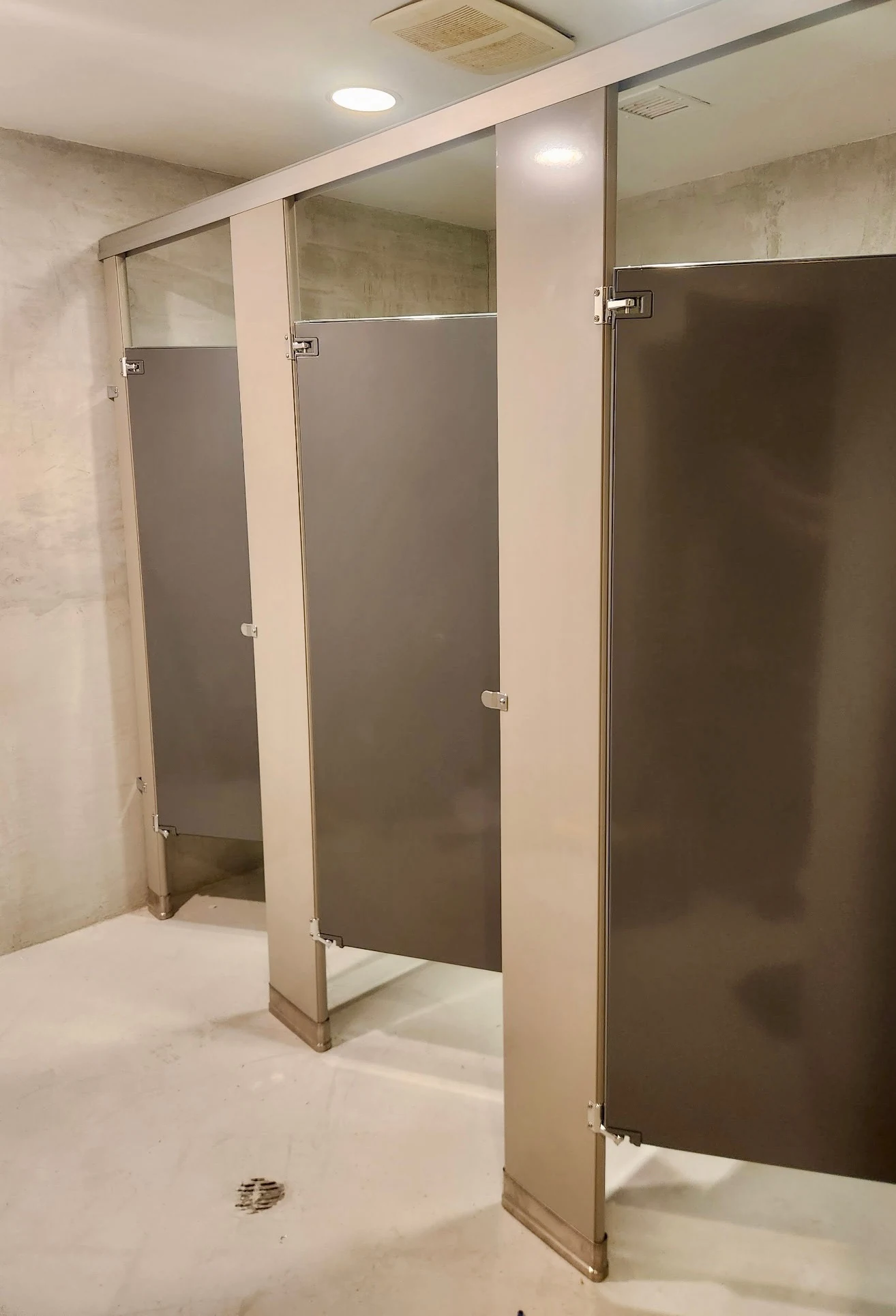 Additional view of powder-coated steel commercial restroom stalls at ITA Kitchen in Garden City South, New York