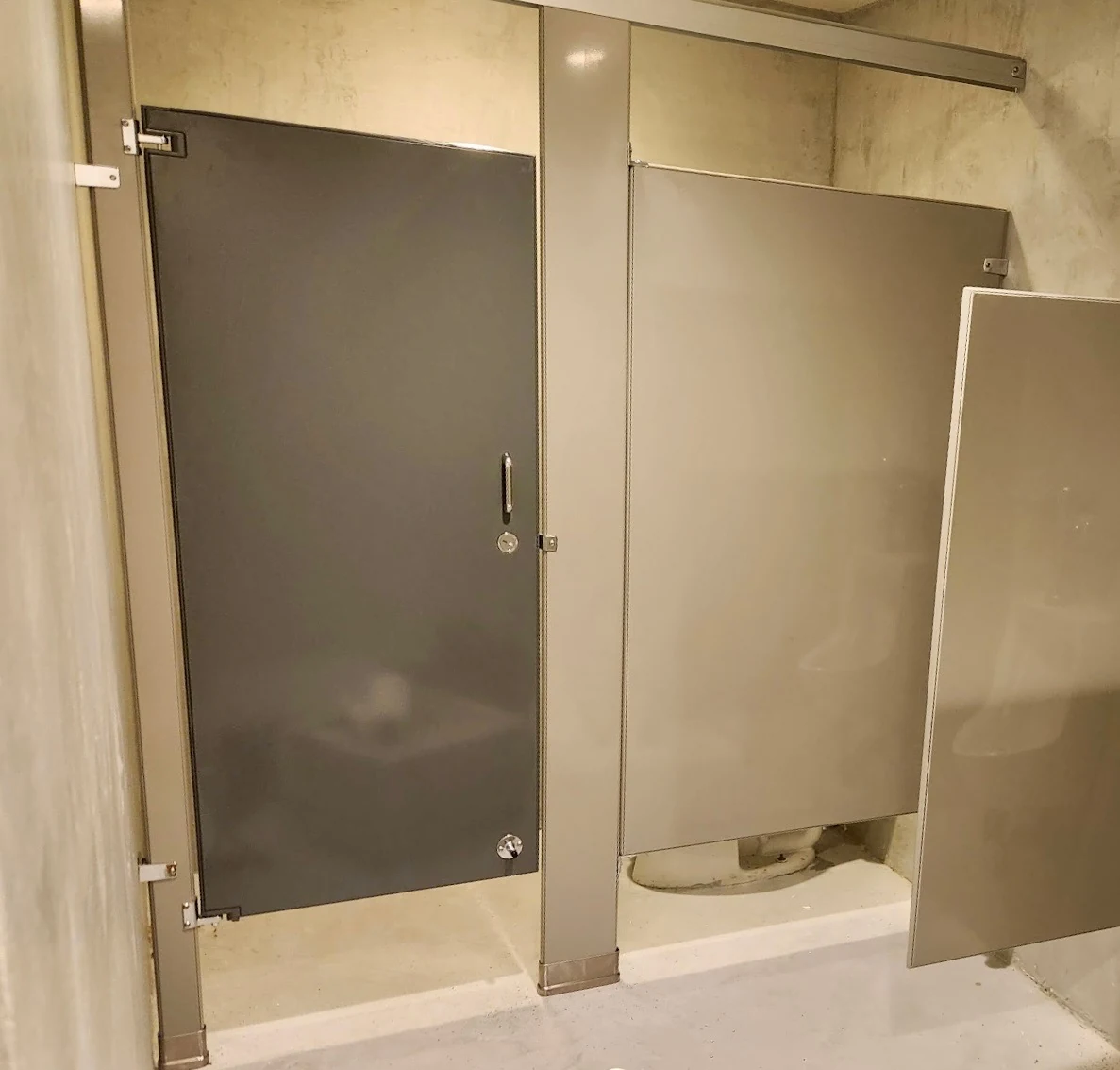 Powder-coated steel commercial restroom stalls at ITA Kitchen in Garden City South, New York