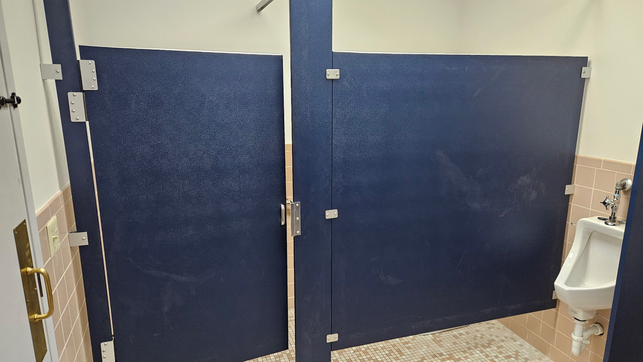 Solid-plastic commercial restroom compartments at Kloeckner Metals in Middletown, Connecticut