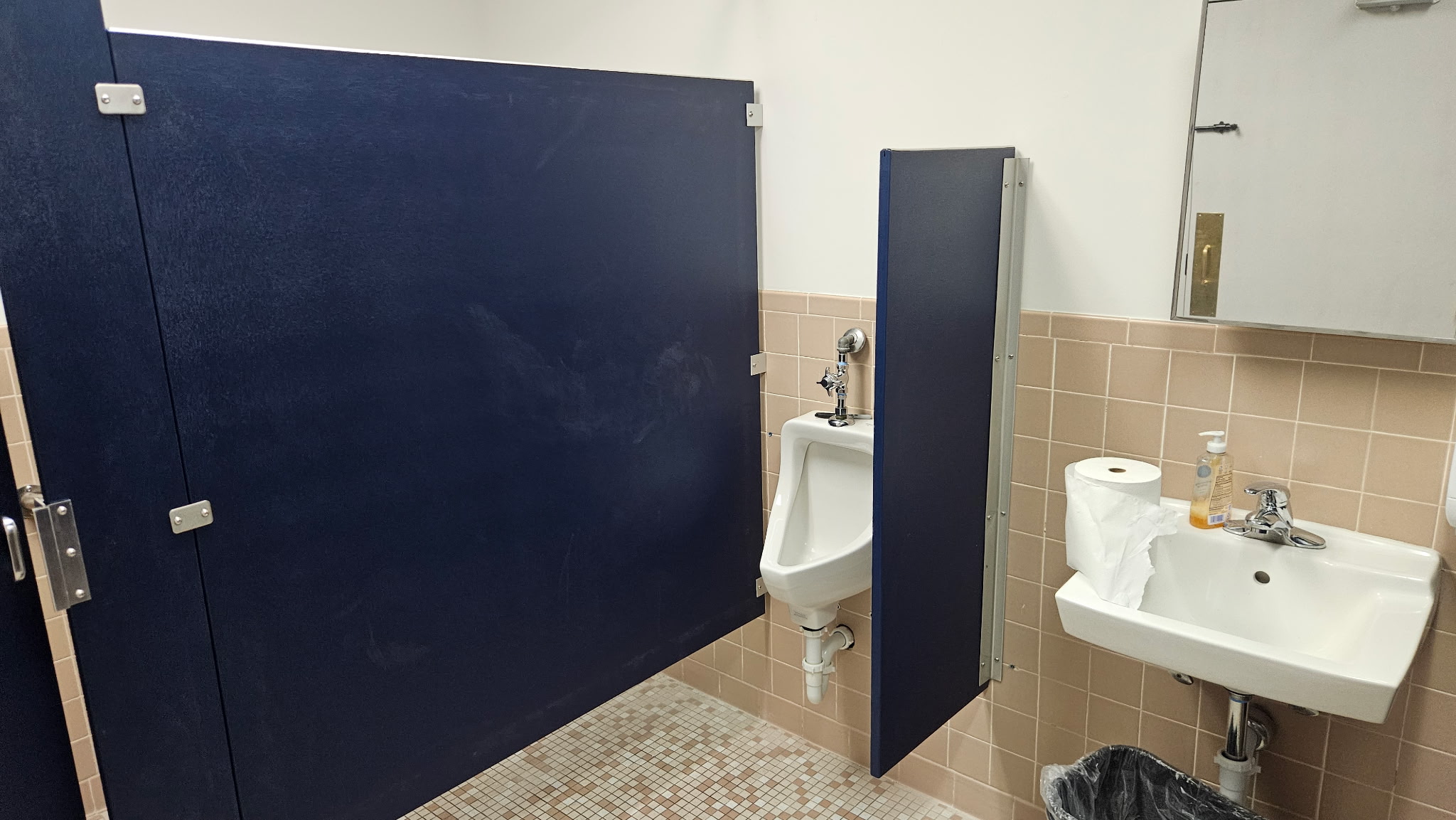 Solid-plastic commercial restroom stalls and screen at Kloeckner Metals in Middletown, Connecticut