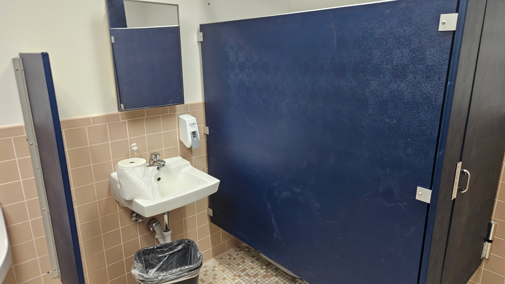 Solid-plastic commercial restroom stall at Kloeckner Metals in Middletown, Connecticut