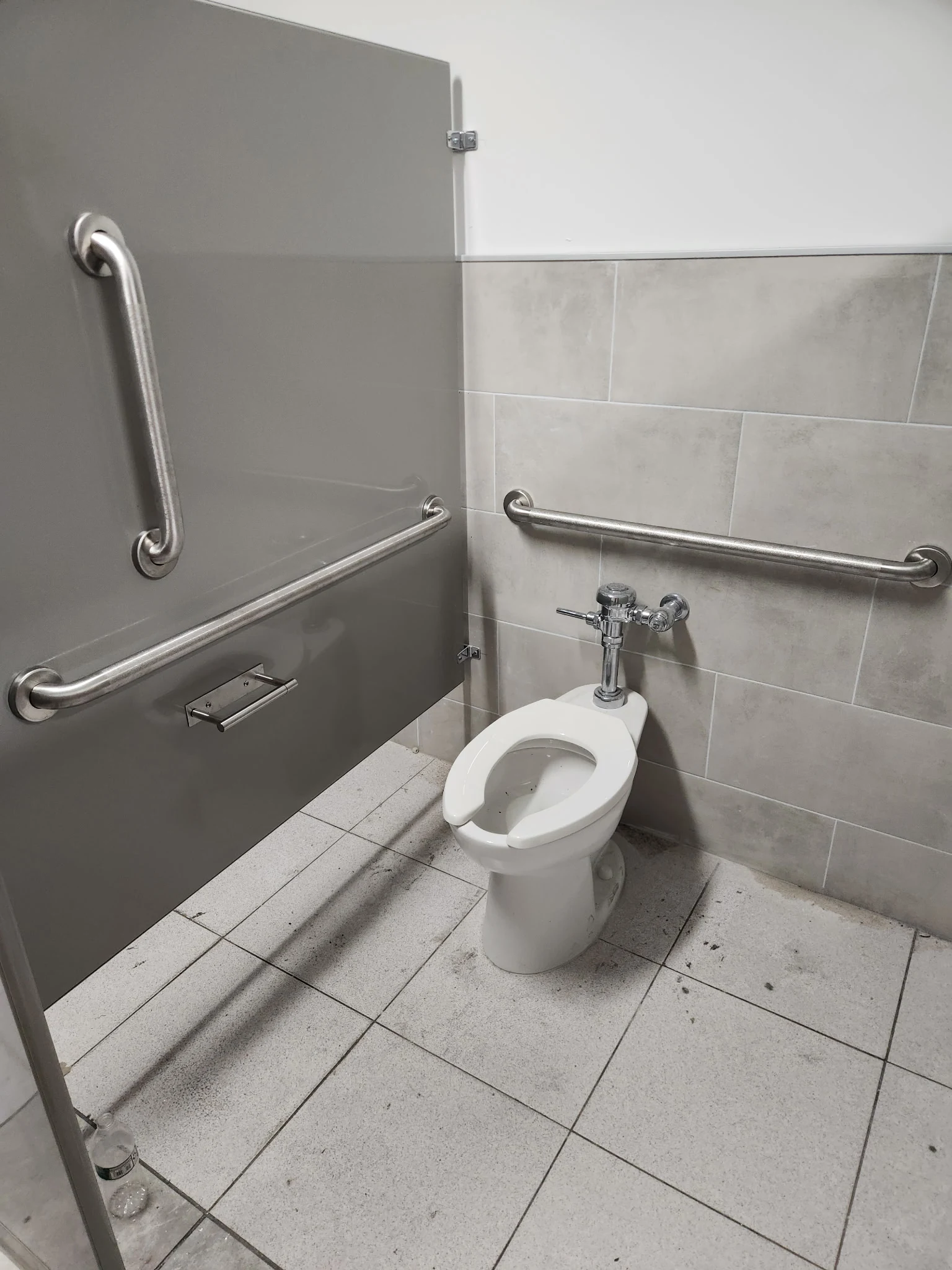 Commercial restroom compartment and adjacent fixtures at Metropolitan Warehouse and Delivery in Perth Amboy, New Jersey