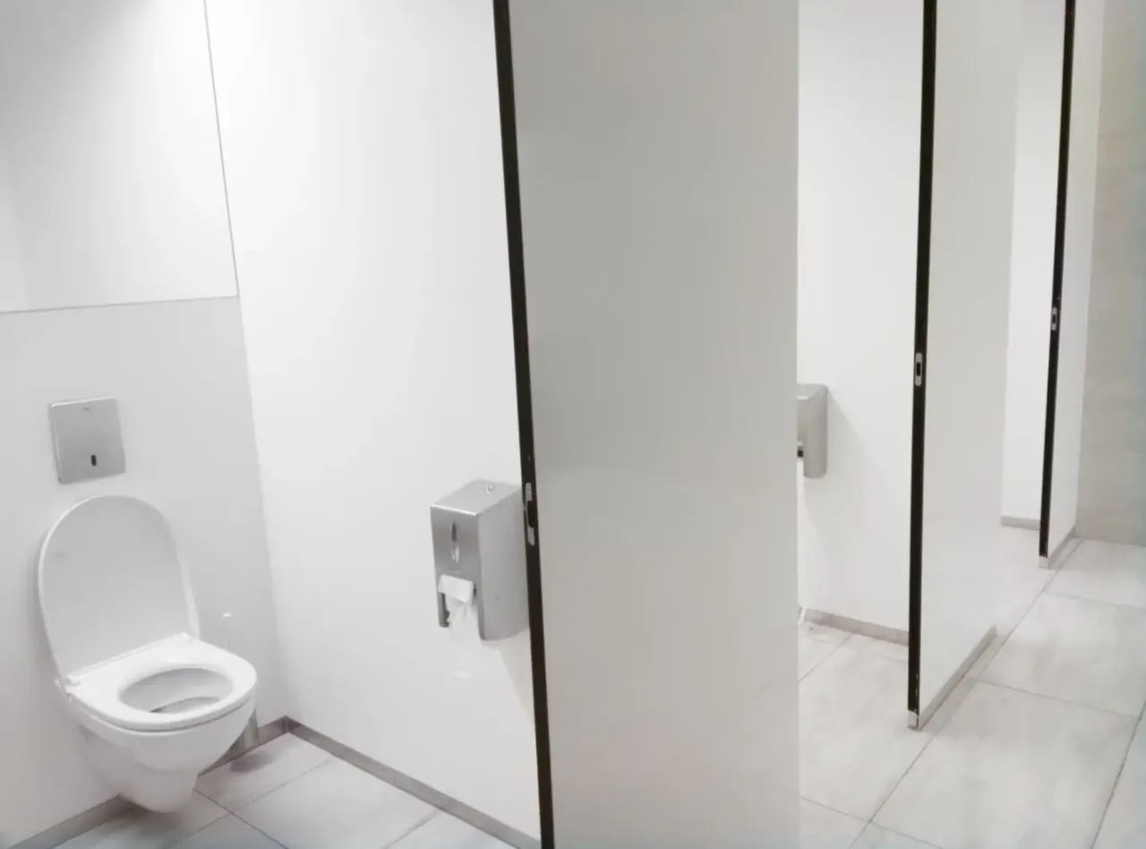 Installed white commercial bathroom partitions