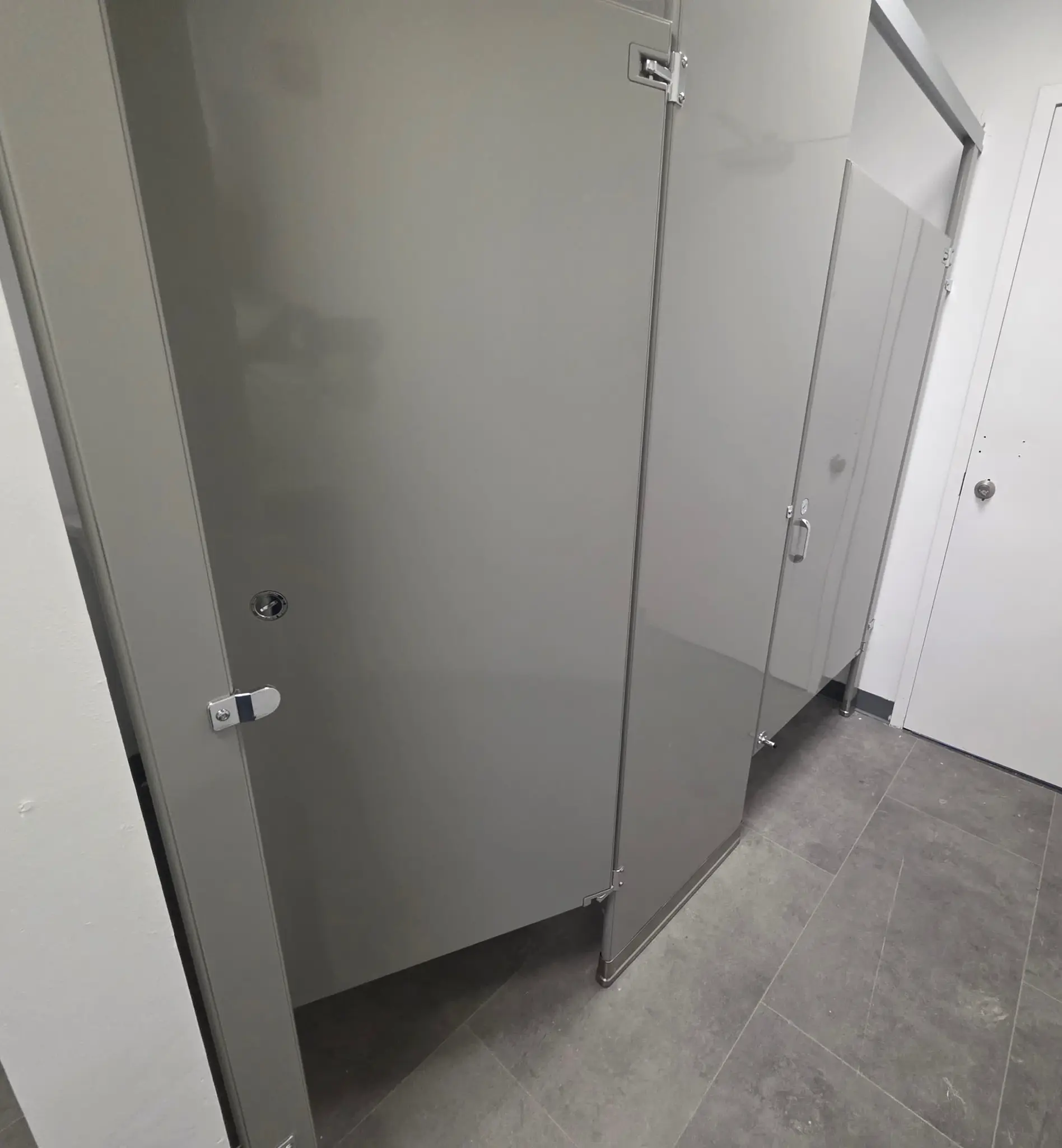 Gray powder-coated-steel commercial restroom stall at the YouthBuild Newark project in Newark, New Jersey